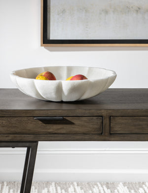 Coralie delicate sculptural decorative Bowl filled with fruit on a table.