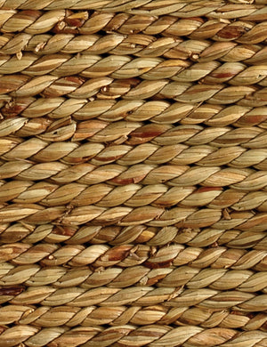 Close up of the Taina hexagonal braided seagrass side table.