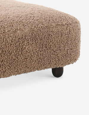 Corner of the Dover faux shearline long ottoman.