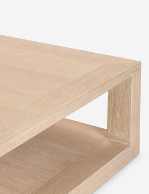 Corner of the Kristoff bleached oak minimalist rectangle coffee table.