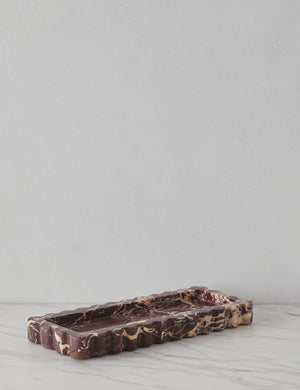 Angled view of the 512 long scalloped decorative tray in cherry marble