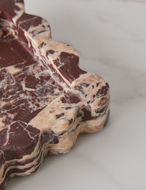 Close up view of the corner of the 512 long scalloped decorative tray in cherry marble