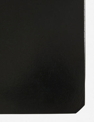 Bird’s-eye view of the surface on the corner of the Anabella black wood dresser with silver drawer pulls