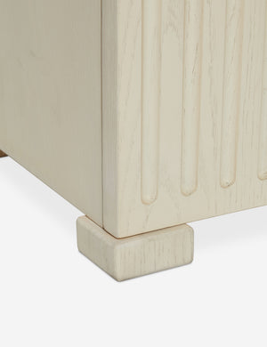 Close up of the bottom of the Beck grooved light wood nightstand.