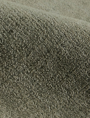 Close up of the Damara solid viscose rug in sage.