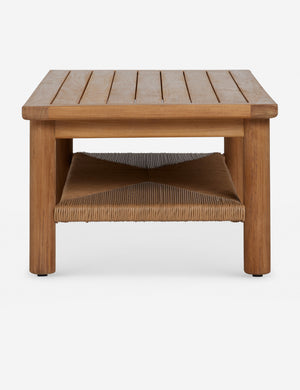 Side profile of the Gally teak and wicker outdoor coffee table.