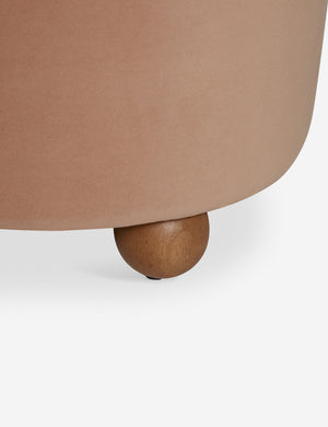 Wooden foot of the Judson modern round velvet dining chair.