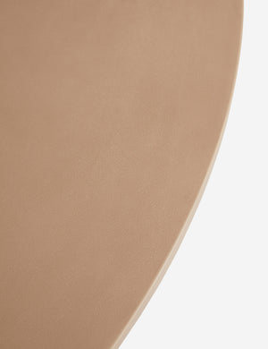 Close up of the Keating sculptural round fiberstone outdoor dining table.