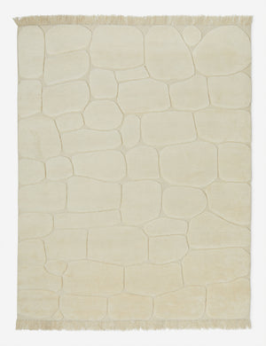 Kivi raised cobblestone pattern fringe wool area rug