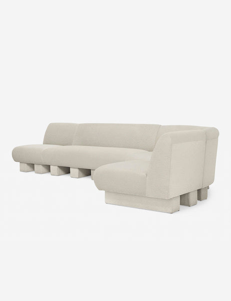 #color::Ivory-Boucle #configuration::right-facing #size::142-W | Angled view of the Lena right-facing white boucle sectional sofa with upholstered beam legs.