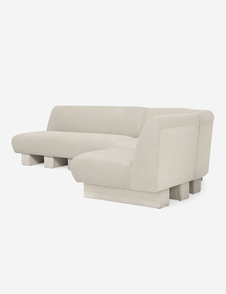 #color::Ivory-Boucle #configuration::right-facing #size::114-W | Angled view of the Lena right-facing white boucle sectional sofa with upholstered beam legs.