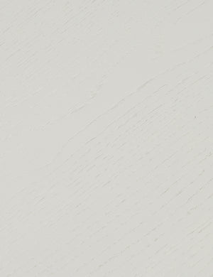 Close up of the finish of the Lowen double pedestal base white washed dining table.
