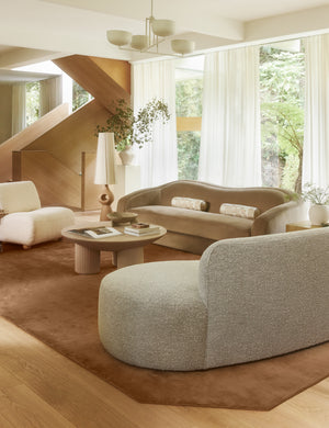 Rhodes sculptural ceramic floor lamp styled in a living room.