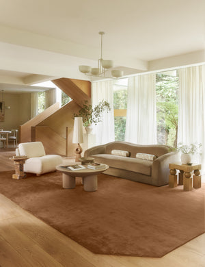 Living room featuring the Damara solid viscose rug in rose.
