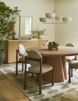 Rhodes sculptural ceramic table lamp styled on a sideboard in a dining room.