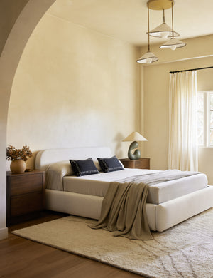 Accord Black Linen Lumbar Pillow by Elan Byrd styled in a bedroom.