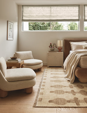 A bedroom featuring the Rhodes sculptural ceramic table lamp on a nighstand.