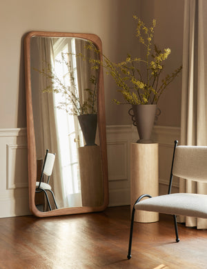 Panthea textural tapered loop handle ceramic vase by Aimee Song styled on a pedestal next to a floor mirror