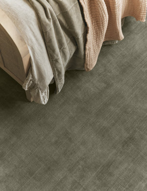 Bedroom featuring the Damara solid viscose rug in sage.