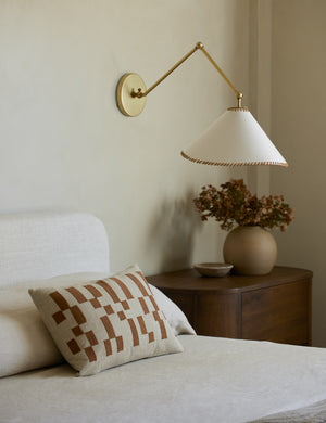 Mosaic Linen Lumbar Pillow by Elan Byrd styled on a bed.