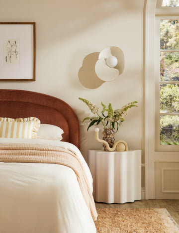 #color::ivory #size::tall | Lune half-moon, scalloped concrete side table styled as a nightstand