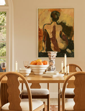 Cascading matte ceramic serving bowl styled on a dining table