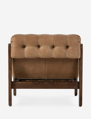 Cantor button-tufted armless leather accent chair.
