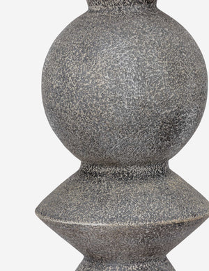 Close up of the base of the Bulsara geometric, stone-finish ceramic table lamp
