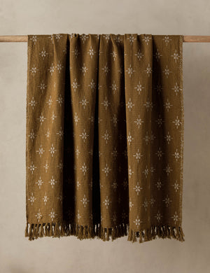 The Fania lightweight linen-cotton blend floral motif throw.