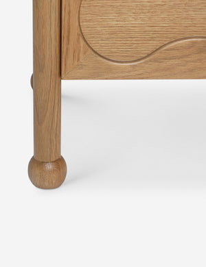 Close up view of the Fontaine wavy detailing solid oak sideboard by Aimee Song