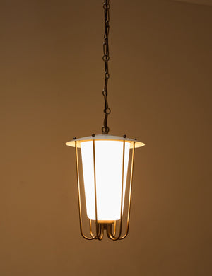 Frederick tapered glass shade chain pendant light by Heidi Caillier with the light turned on