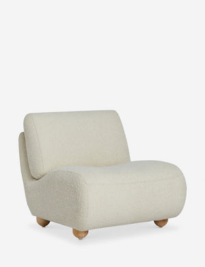 Angled view of the Kya textural boucle armless accent chair.