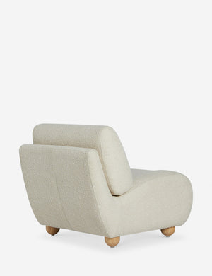Angled back view of the Kya textural boucle armless accent chair.