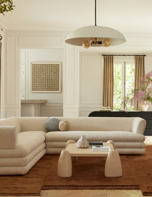 Brolly matte white, 3-bulb dome pendant light hanging over a sectional sofa and square coffee table