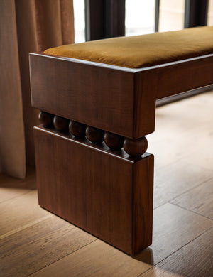Close up of the wooden leg of the Ceiba mixed-material sculptural accent bench by Carly Cushnie.