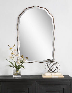 Gannet scalloped frame wall mirror hanging above a console table