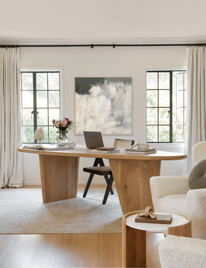 The Rina abstract netural gray toned Wall Art with a brushstroke texture sits in an office with a woven dining chair, an oval wooden dining table, and white boucle accent chairs