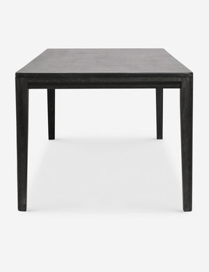 Side view of the Reese black mango wood rectangular dining table.