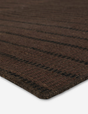 Close up of the Shere handwoven striped outdoor rug by Sarah Sherman Samuel in Brown