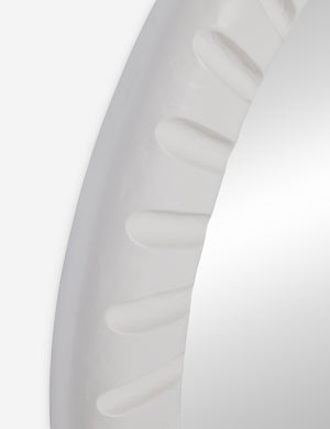 Angled close up of the Tapp white framed round wall mirror