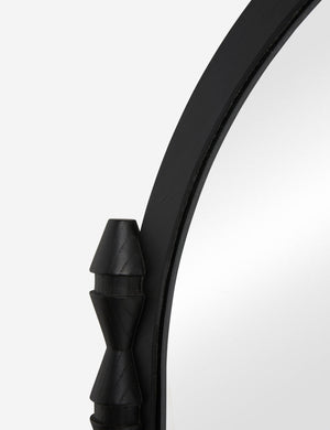 Close up of the Topia arched carved wood mantel mirror by Ginny Macdonald in black.