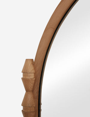 Close up of the Topia arched carved wood mantel mirror by Ginny Macdonald in natural.