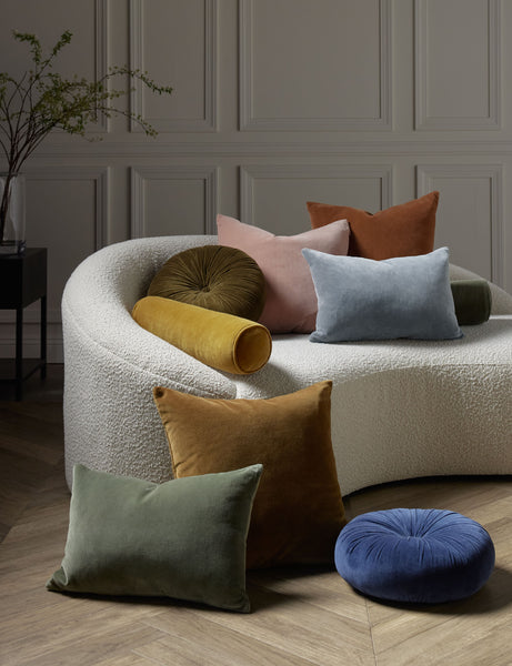  #color::ice-blue #style::lumbar  #fill type::with-feather-down-insert  #fill type::pillow-cover-only |   Charlotte velvet pillow in moss, rosewater, ice blue, burnt orange, and toast sit next to and on a cream boucle lounger