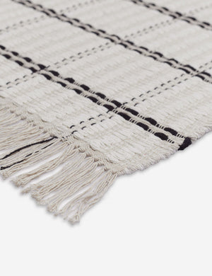 Close up of the tasseled ends on the corner of the Elin Bath Mat