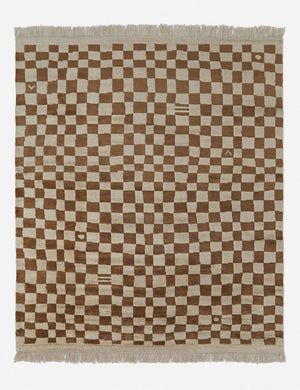 Irregular ochre checkerboard rug by Sarah Sherman Samuel