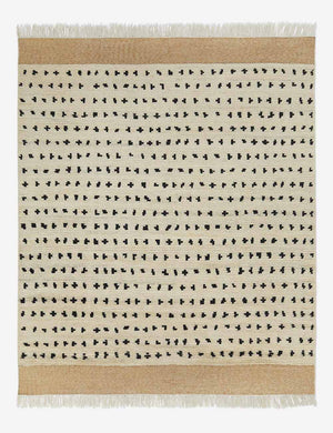 Irregular dots ivory rug with a mixed dot motif and brown flatwoven border with fringe by Sarah Sherman Samuel