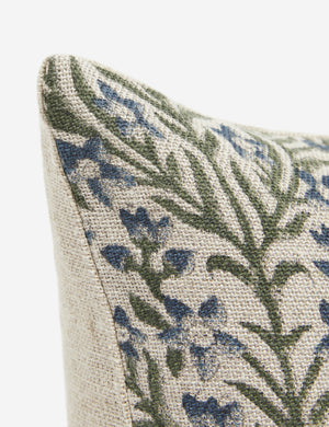 Close-up of the corner of the Ixora square pillow with ornate floral pattern