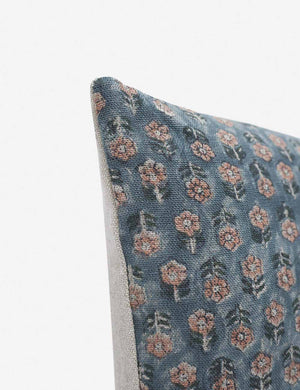 Corner-shot of the Tamra blue and pink square pillow with floral patterns