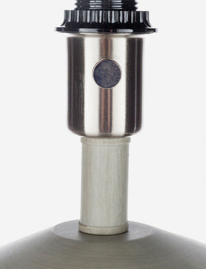 Close-up of the light bulb insert on the Bhavanah Table Lamp with a gray spindle designed base
