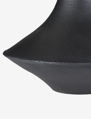 Close-up of the sculptural base on the Coulwood black table lamp